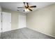 Bright bedroom with ceiling fan and double door closet at 3621 Ronda Dr, Deltona, FL 32738