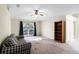 Living room featuring a plaid couch and built-in shelving at 3621 Ronda Dr, Deltona, FL 32738