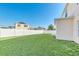 Large backyard with a two-story house and white fence at 415 Big Sioux Ct, Kissimmee, FL 34759