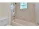 Clean bathroom with shower/tub combo and window at 415 Big Sioux Ct, Kissimmee, FL 34759