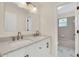Updated bathroom with double vanity and a bathtub at 415 Big Sioux Ct, Kissimmee, FL 34759