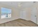 Spacious bedroom featuring wood-look floors and double closets at 415 Big Sioux Ct, Kissimmee, FL 34759