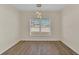 Bright dining room features light walls, wood-look floors, and a modern light fixture at 415 Big Sioux Ct, Kissimmee, FL 34759