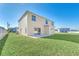 Two-story house with backyard and lawn at 415 Big Sioux Ct, Kissimmee, FL 34759