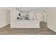 Modern kitchen with white cabinets, stainless steel appliances, and quartz countertops at 415 Big Sioux Ct, Kissimmee, FL 34759
