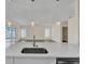 Modern kitchen island with breakfast bar and stainless steel sink at 415 Big Sioux Ct, Kissimmee, FL 34759