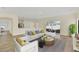 Living room with hardwood floors, staged furniture, and access to a patio at 415 Big Sioux Ct, Kissimmee, FL 34759