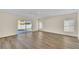 Bright living room featuring hardwood floors and access to backyard at 415 Big Sioux Ct, Kissimmee, FL 34759