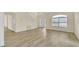Living area with hardwood floors, high ceilings, and a view of the staircase at 415 Big Sioux Ct, Kissimmee, FL 34759