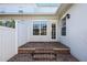A private brick patio with steps leading up to the back door at 4459 Twinview Ln, Orlando, FL 32814