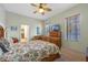 Bright bedroom with wooden bed frame and built-in dresser at 4459 Twinview Ln, Orlando, FL 32814