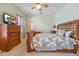 Spacious bedroom with a wooden bed frame and chest of drawers at 4459 Twinview Ln, Orlando, FL 32814