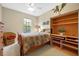 Cozy bedroom with a double bed and built-in shelving at 4459 Twinview Ln, Orlando, FL 32814