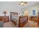 Bedroom with a wooden bed frame, dresser, and home office space at 4459 Twinview Ln, Orlando, FL 32814
