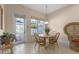 Bright breakfast nook with a table and chairs near sliding glass doors at 4459 Twinview Ln, Orlando, FL 32814