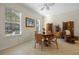 Cozy dining area with a wood table and wicker chairs at 4459 Twinview Ln, Orlando, FL 32814