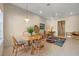 Bright dining area with wood table and chairs, complemented by a colorful rug at 4459 Twinview Ln, Orlando, FL 32814