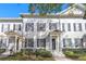 White townhouses with gray shutters and columns at 4459 Twinview Ln, Orlando, FL 32814