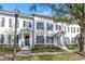 Row of townhouses on tree-lined street at 4459 Twinview Ln, Orlando, FL 32814