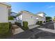 Attached garage with white door and landscaping at 4459 Twinview Ln, Orlando, FL 32814