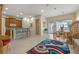 Open concept kitchen and dining area with breakfast bar, wood cabinets, and tile flooring at 4459 Twinview Ln, Orlando, FL 32814
