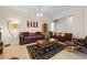 Comfortable living room featuring a leather sofa and coffee table at 4459 Twinview Ln, Orlando, FL 32814