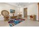 Cozy living room featuring a unique chair and a colorful rug at 4459 Twinview Ln, Orlando, FL 32814