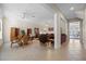 Spacious living room with leather furniture and a large window at 4459 Twinview Ln, Orlando, FL 32814