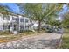 Residential street with parked cars and townhouses at 4459 Twinview Ln, Orlando, FL 32814