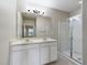 Clean bathroom with double vanity and a walk-in shower at 4775 Terrasonesta Dr, Davenport, FL 33837