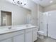 Bright bathroom with double vanity, shower, and toilet at 4775 Terrasonesta Dr, Davenport, FL 33837