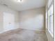 Spacious bedroom with carpet flooring and ample natural light at 4775 Terrasonesta Dr, Davenport, FL 33837