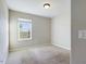 Bright bedroom featuring a large window and neutral wall tones at 4775 Terrasonesta Dr, Davenport, FL 33837
