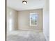 Simple bedroom with window and carpeted floor at 4775 Terrasonesta Dr, Davenport, FL 33837