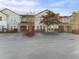 Front view of charming townhouses with well-manicured landscaping at 4775 Terrasonesta Dr, Davenport, FL 33837