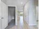 Bright hallway with tile flooring and access to other rooms at 4775 Terrasonesta Dr, Davenport, FL 33837