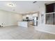 Modern kitchen with stainless steel appliances and an island at 4775 Terrasonesta Dr, Davenport, FL 33837