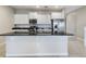 Modern kitchen with stainless steel appliances and granite countertop at 4775 Terrasonesta Dr, Davenport, FL 33837