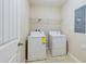 Laundry room with washer, dryer, and shelving at 4775 Terrasonesta Dr, Davenport, FL 33837