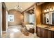 Spa-like bathroom with soaking tub, double vanities, and elegant decor at 5271 Isleworth Country Club Drive, Windermere, FL 34786