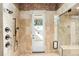 Spa-like bathroom with walk-in shower, soaking tub, and marble tile at 5271 Isleworth Country Club Drive, Windermere, FL 34786