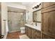 Spa-like bathroom with walk-in shower and vanity at 5271 Isleworth Country Club Drive, Windermere, FL 34786