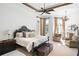 Main bedroom with plush bed, sitting area, and fireplace at 5271 Isleworth Country Club Drive, Windermere, FL 34786