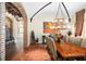 Elegant dining room features a large wood table, chandelier, and brick accents at 5271 Isleworth Country Club Drive, Windermere, FL 34786