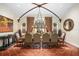 Formal dining room with a large table, ornate chandelier, and tile floor at 5271 Isleworth Country Club Drive, Windermere, FL 34786