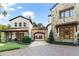 Home features a brick driveway, stone facade, and arched garage entry at 5271 Isleworth Country Club Drive, Windermere, FL 34786