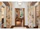 Elegant hallway with stone columns and arched doorways leading to an office at 5271 Isleworth Country Club Drive, Windermere, FL 34786