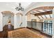 Upper hallway with arched entryways and view of lower level at 5271 Isleworth Country Club Drive, Windermere, FL 34786