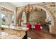 Open kitchen with granite island and views of living room at 5271 Isleworth Country Club Drive, Windermere, FL 34786