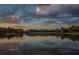 Scenic lake view at sunset with reflections at 5271 Isleworth Country Club Drive, Windermere, FL 34786